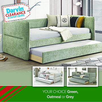 A Darvin Clearance & Outlet Center promotional image showcasing a green upholstered daybed with a pull-out trundle bed underneath. The room features modern decor with neutral walls, a floor lamp, and accent pillows on the daybed. Two smaller inset images at the bottom show the same style available in additional colors (oatmeal and grey). A green banner reads: YOUR CHOICE Green, Oatmeal or Grey.