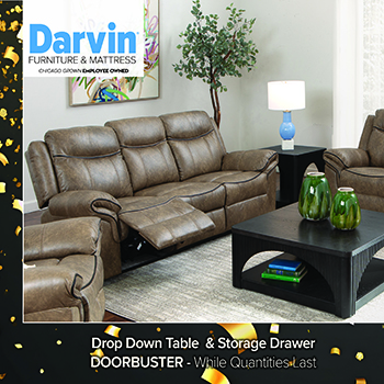 Promotional image of a modern living room featuring a gray leather reclining sofa set with power headrests. A light wood drop-down coffee table sits on a patterned area rug between the seating. Text reads “Darvin Furniture & Mattress, Chicago Owned Family Owned” and highlights features: Power Headrests, Drop Down Table, Zero Gravity, Air Massage, Immersive Audio & Vibration.