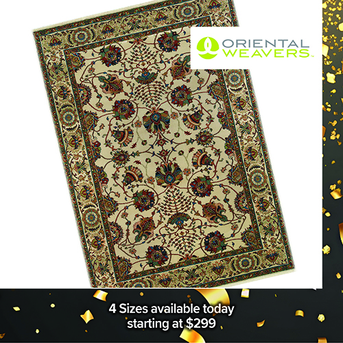 Promotional image of a modern white table lamp with a tapered marble-style base and white drum shade, displayed on a glass side table next to flowers and decor. Text at the bottom reads, Lamp Now $219.99.