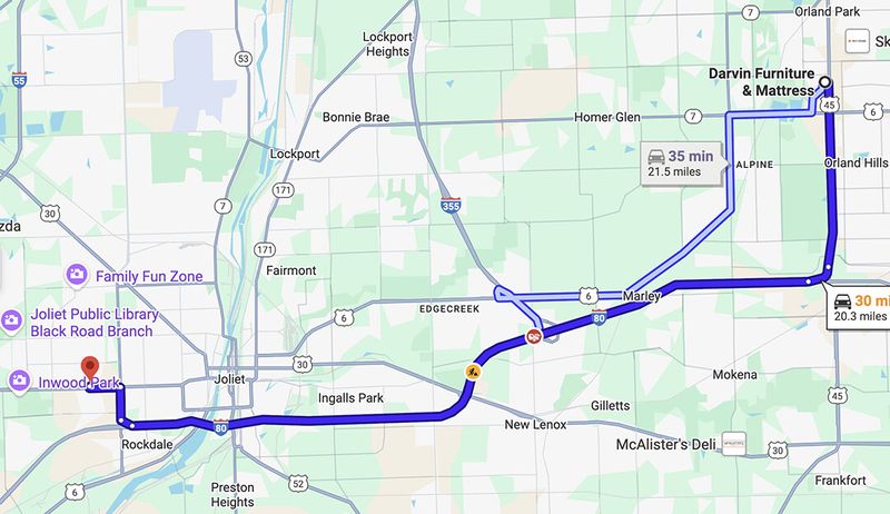 A Google Maps screenshot showing driving directions from Inwood Park in Joliet, Illinois, to Darvin Furniture & Mattress in Orland Park. The highlighted route follows I-80 east through Rockdale, New Lenox, and Marley, then heads north toward Orland Park. The trip is approximately 20–22 miles and takes about 30–35 minutes. Nearby towns and landmarks labeled include Joliet, Lockport, Homer Glen, Orland Hills, Family Fun Zone, and Joliet Public Library Black Road Branch.