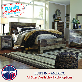 Rustic wood bed frame with matching bedroom furniture in a staged bedroom, featuring a distressed finish and farmhouse-style design