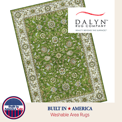 Rectangular patterned area rug in green and beige tones, displayed flat to show ornate border and repeating decorative motifs