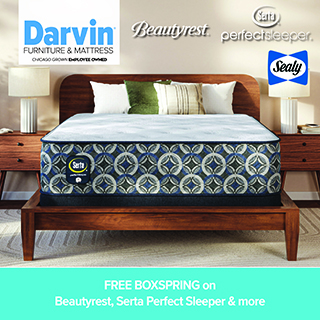 A promotional advertisement for Darvin Furniture & Mattress featuring a mattress sale. The image showcases a mattress with a prominent blue, grey, and white interlocking circle pattern on its side panel, resting on a wooden bed frame flanked by matching wooden nightstands with white lamps. The top of the graphic features logos for Darvin Furniture & Mattress, Beautyrest, Serta Perfect Sleeper, and Sealy. A solid teal banner along the bottom reads 'FREE BOXSPRING on Beautyrest, Serta Perfect Sleeper & more' in white text.