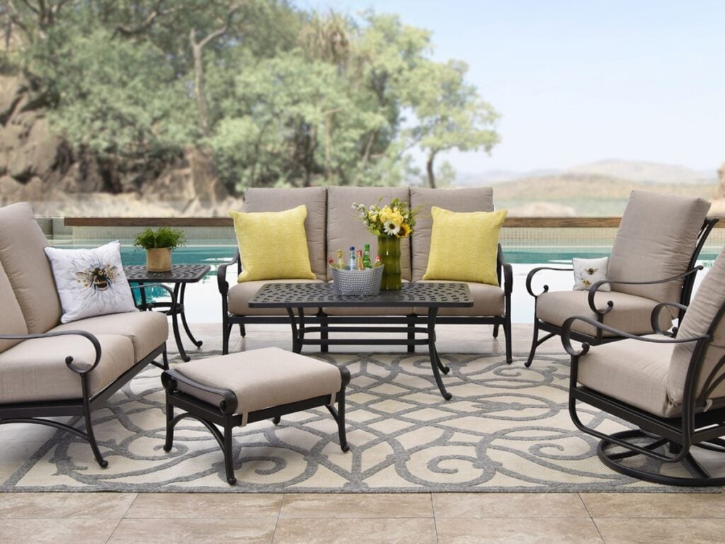 Patio seating set with cushioned chairs and table