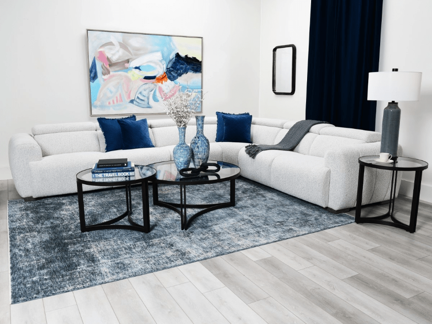 Living room with patterned accent chairs and glass coffee table