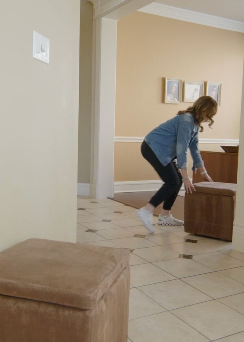 Person moving furniture out of the way