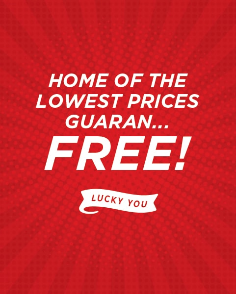 Red promotional graphic with bold white text reading ‘Home of the Lowest Prices GUARAN-FREE!’ and a small ribbon below that says ‘Lucky You.’