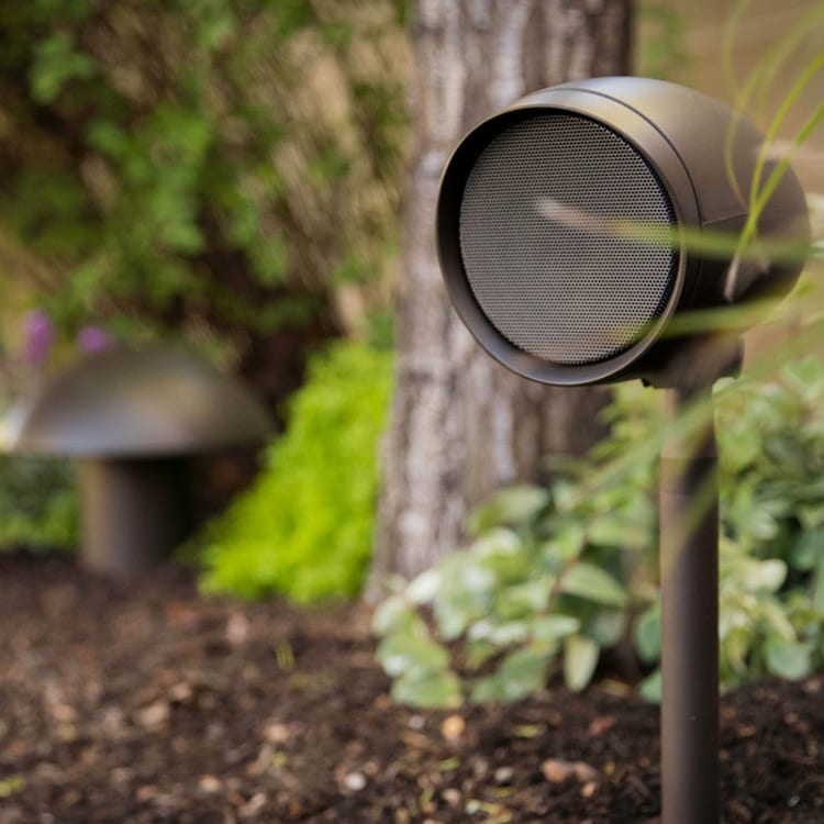 Triad outdoor speakr planted in the garden