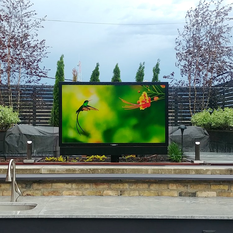 Sunbrite weather proof television in backyard