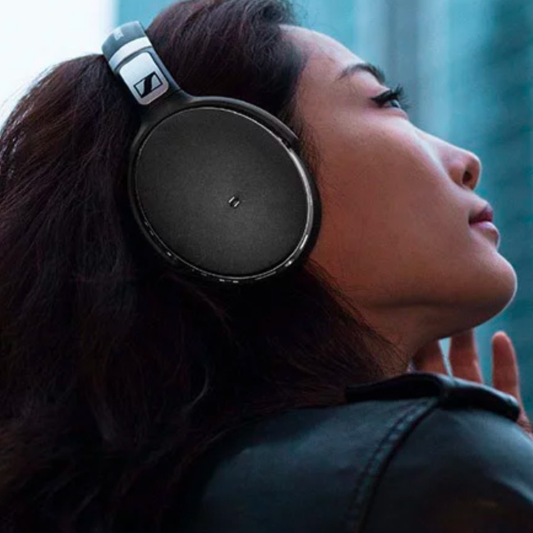 Sennheiser high-end over-ear headphones leaning against window