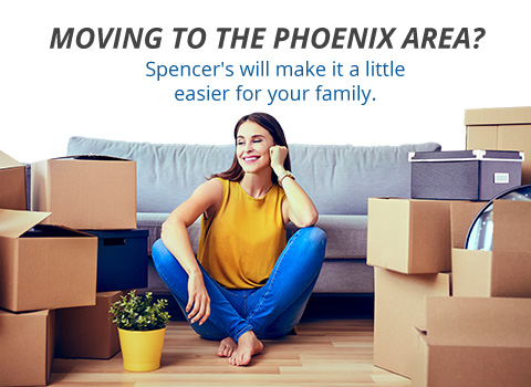 Image of woman packing, surrounded by boxes.