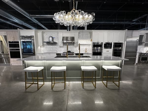 Bright kitchen with stainless appliances on display at Yale Appliance