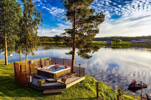 Family in a spa in a beautiful lake setting