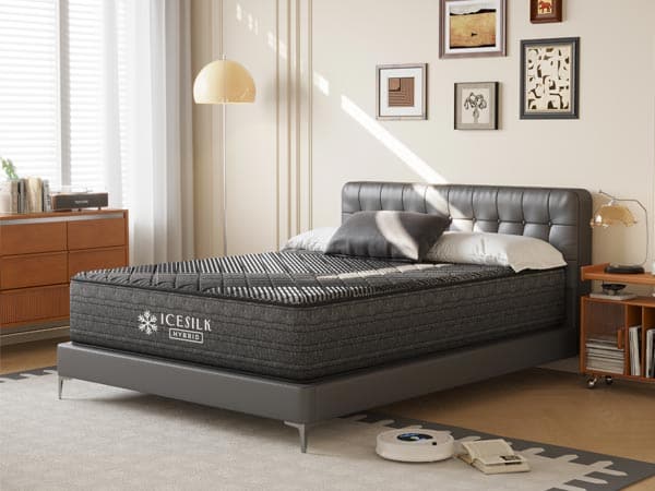 A grey bed with a grey mattress
