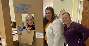 Bekins employees volunteer to build play structures for children at Grace Lutheran Church in Coopersville.