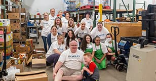 Bekins employees volunteer at Community Action House in Holland