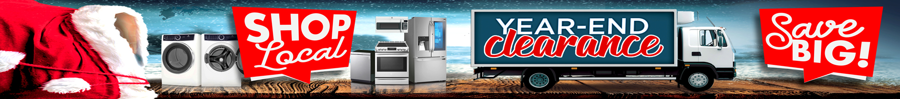 A festive year-end clearance banner shows the side of Santa’s red suit on the left, followed by images of home appliances including a washer, dryer, oven, and refrigerator. In the center, a large delivery truck displays the words YEAR-END clearance. Bright red signs read “SHOP Local” on the left and Save BIG! on the right. The scene has a wintery, ocean-side background with wooden planks in the foreground.