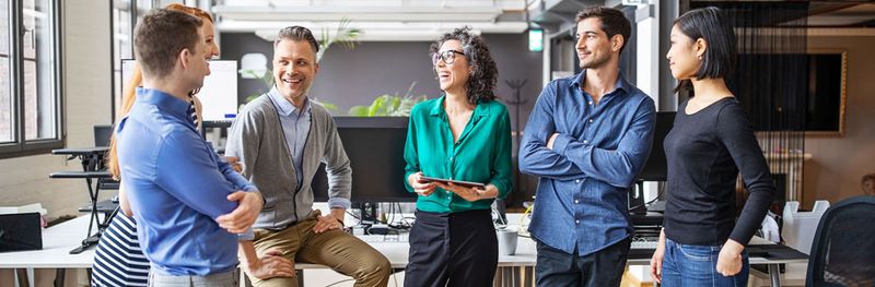 coworkers hanging out and talking in the office