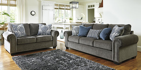 Living room with sofas, chair, and center table