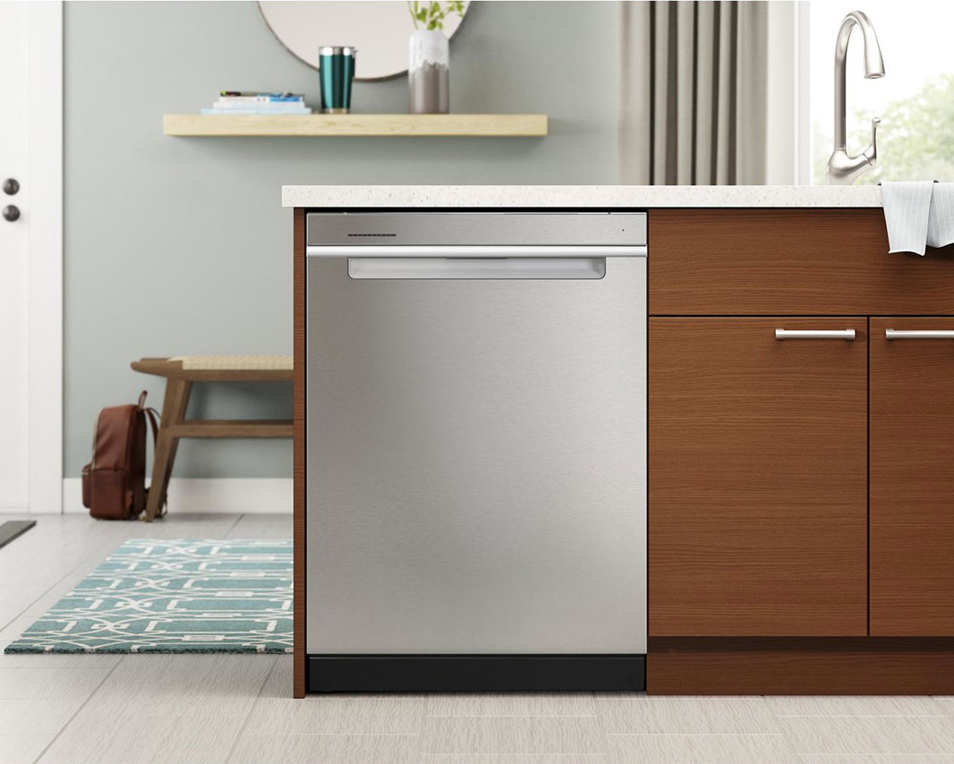 Open dishwasher filled with plates