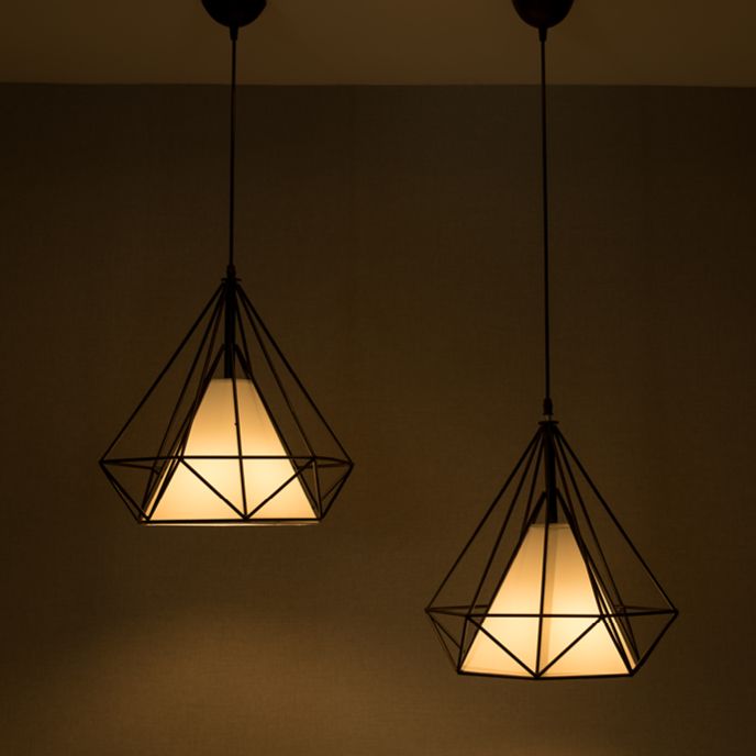 Cone-shaped accent lighting with scrolling iron details.